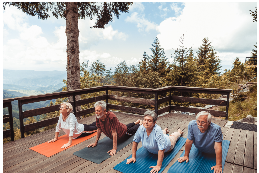 retirees doing yoga outdoors