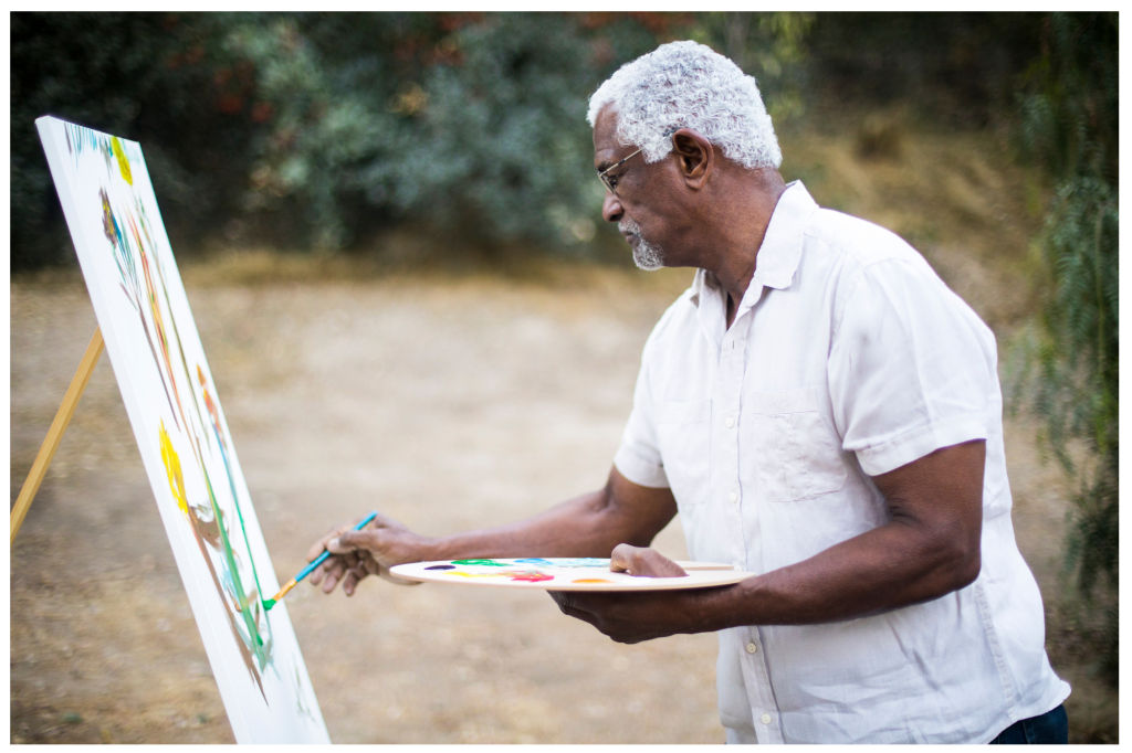 black retired man painting